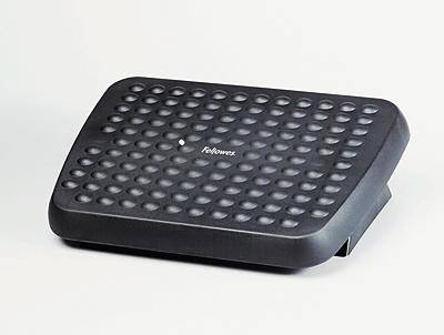 Repose-pieds ergonomique noir à surface texturée avec picots, conçu pour masser et soutenir les pieds pendant l'assise.