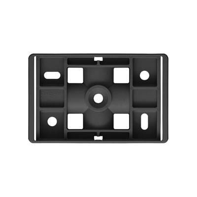 Support rectangulaire noir avec plusieurs découpes irrégulières et un élément circulaire au centre.