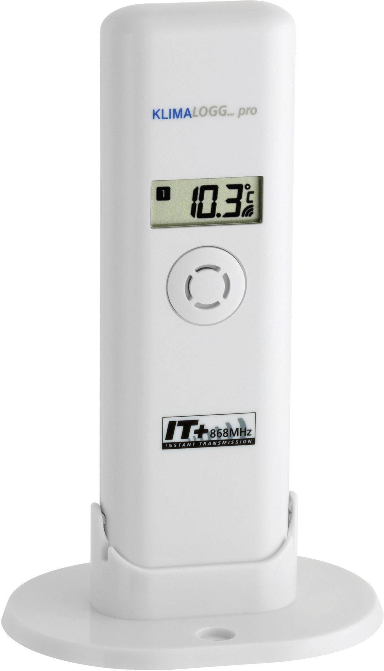 Un thermomètre numérique affiche une température de 10,3 degrés Celsius. L'appareil est blanc et se trouve dans un support.