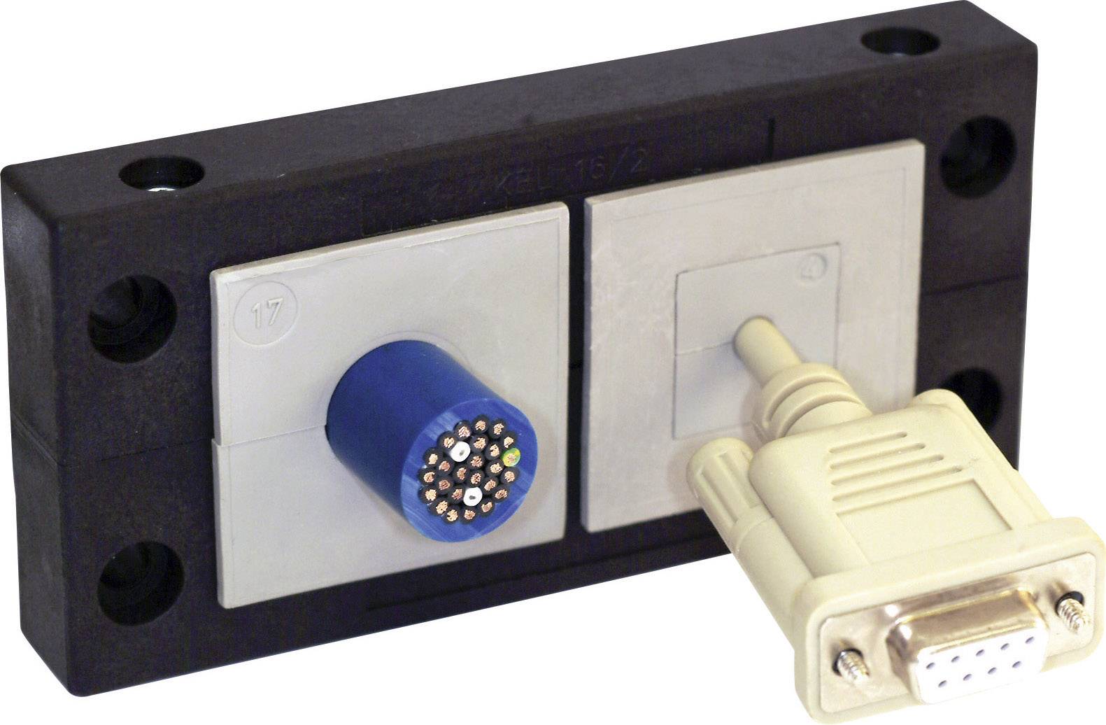 Un bloc adaptateur noir avec deux modules de prises, l'un doté d'un connecteur rond multibroche et l'autre équipé d'une prise rectangulaire à laquelle est connecté un connecteur beige.