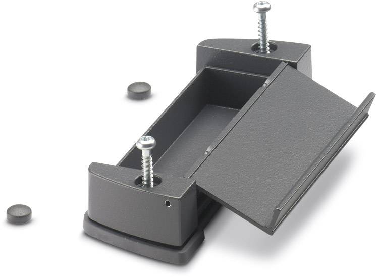 Un boîtier en plastique noir avec deux vis et un couvercle amovible. Deux petites pièces rondes supplémentaires sont posées à côté.