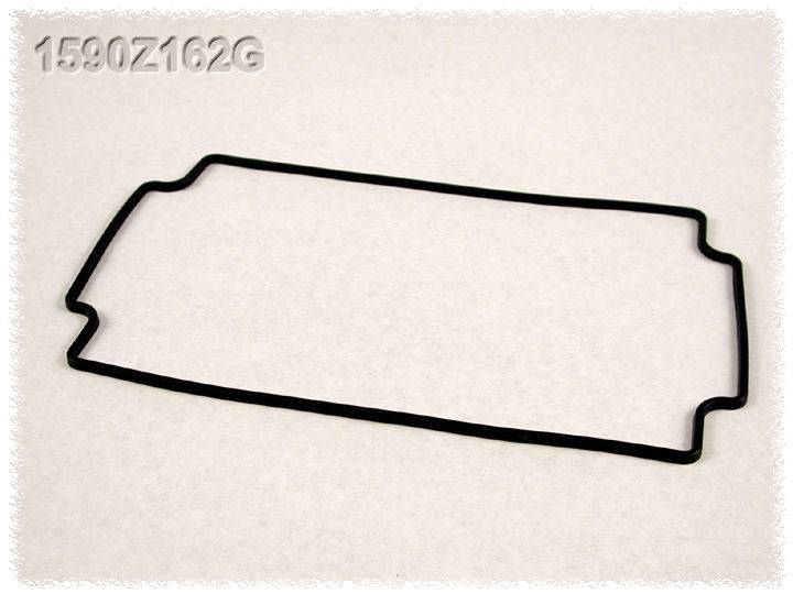 Un joint noir rectangulaire avec des coins biseautés, posé sur un fond clair portant l'inscription '1580Z162G' en haut à gauche.