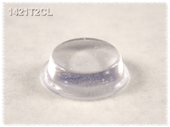 Des pieds en caoutchouc transparents, mi-ronds, portant la désignation '1421T2CL', posés sur une surface lisse.