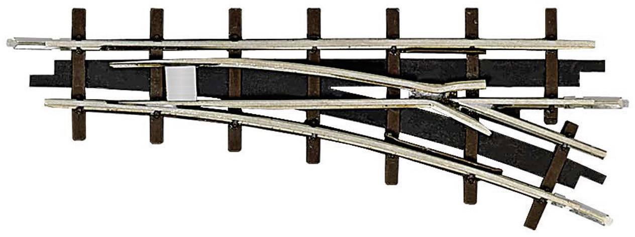 Aiguillage d'un rail de train miniature, rails chromés sur un support en bois sombre, montrant un branchement.
