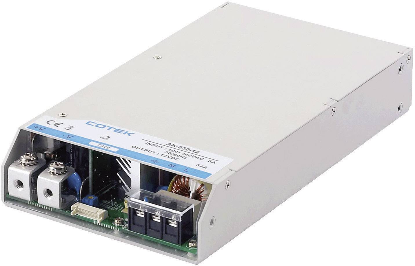 Un bloc d'alimentation rectangulaire avec boîtier métallique et connexions, utilisé pour alimenter divers appareils. Étiquette portant l'inscription « COTEK ».