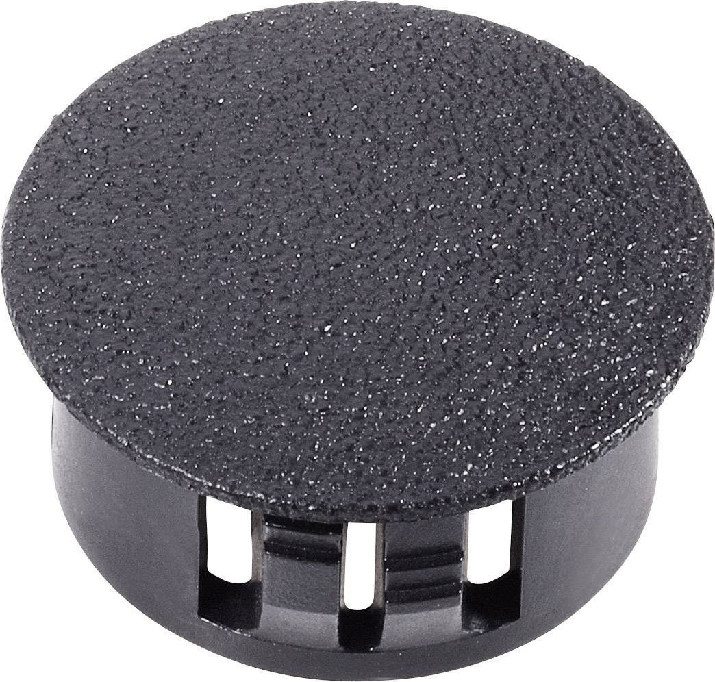 Couvercle noir rond en plastique avec surface texturée et fentes de ventilation sur le côté.