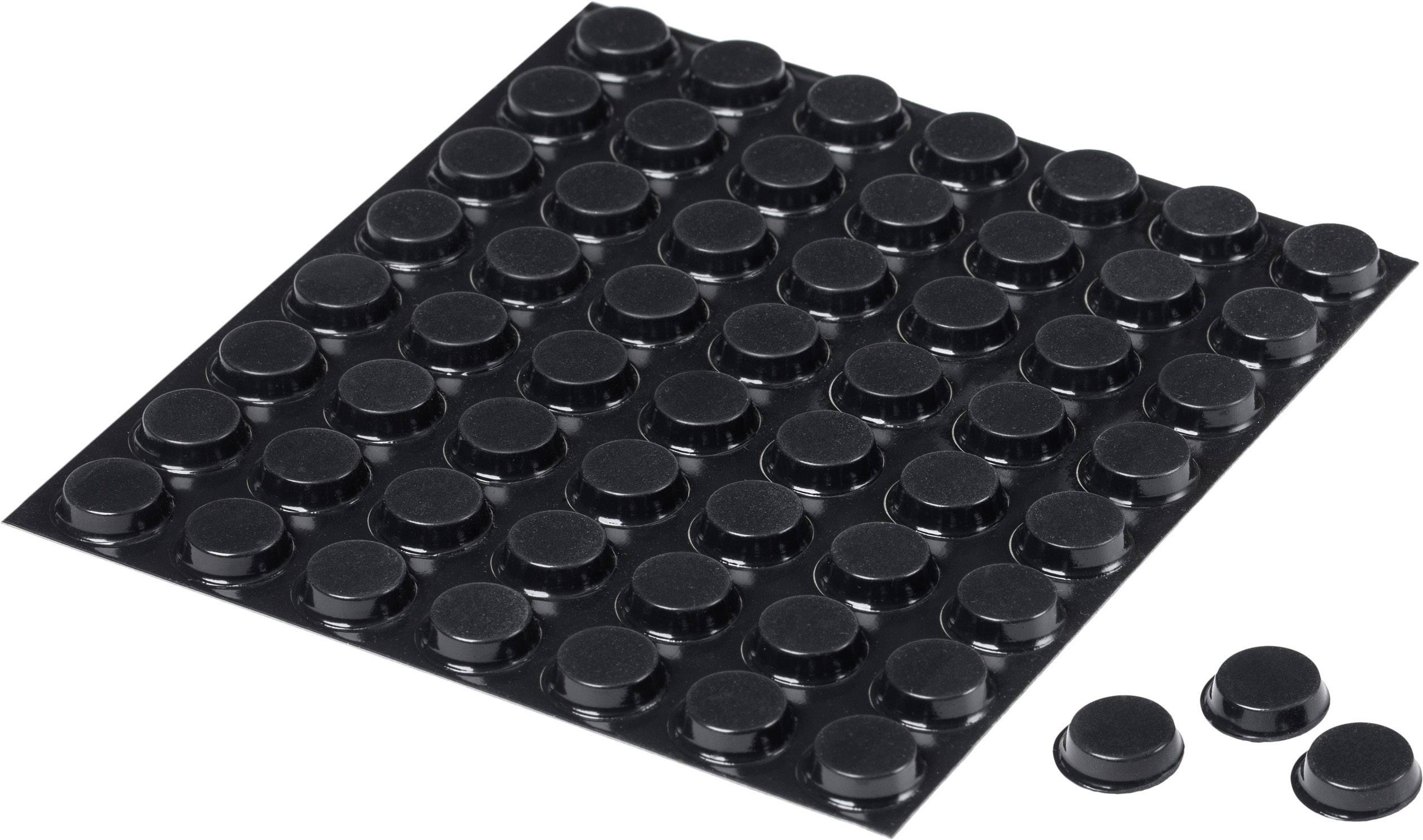 Une plaque noire texturée avec des pieds en caoutchouc amovibles et ronds, conçus pour amortir les vibrations ou protéger les surfaces.
