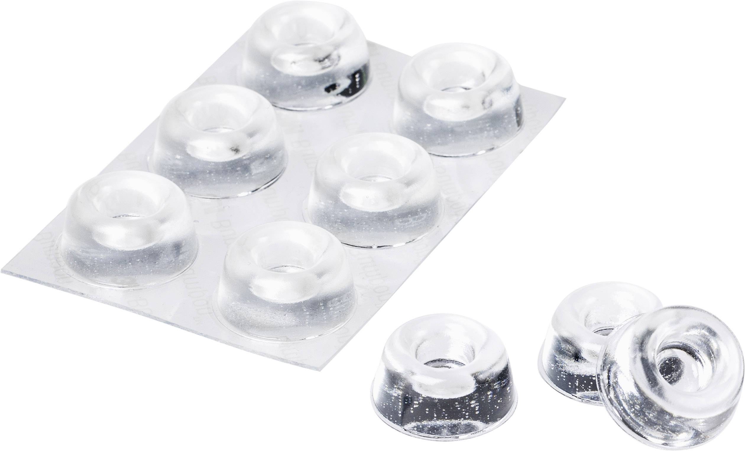 Un emballage de tampons en caoutchouc transparents contenant sept pièces sur un blister, avec deux pièces supplémentaires posées à côté.