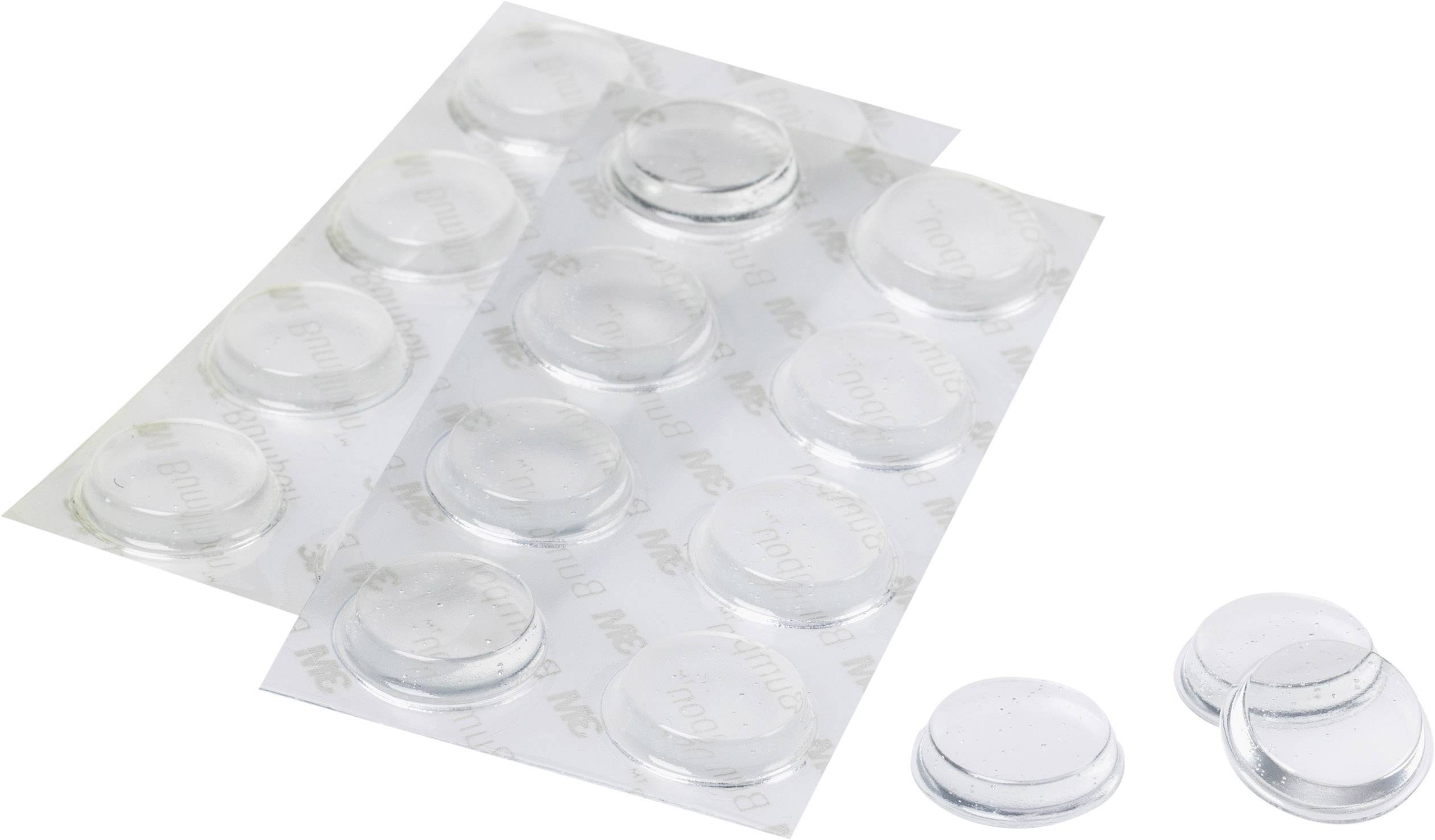 Pastilles adhésives transparentes et rondes sur film, certaines étant séparées. Idéales pour fixer des objets sur des surfaces lisses.