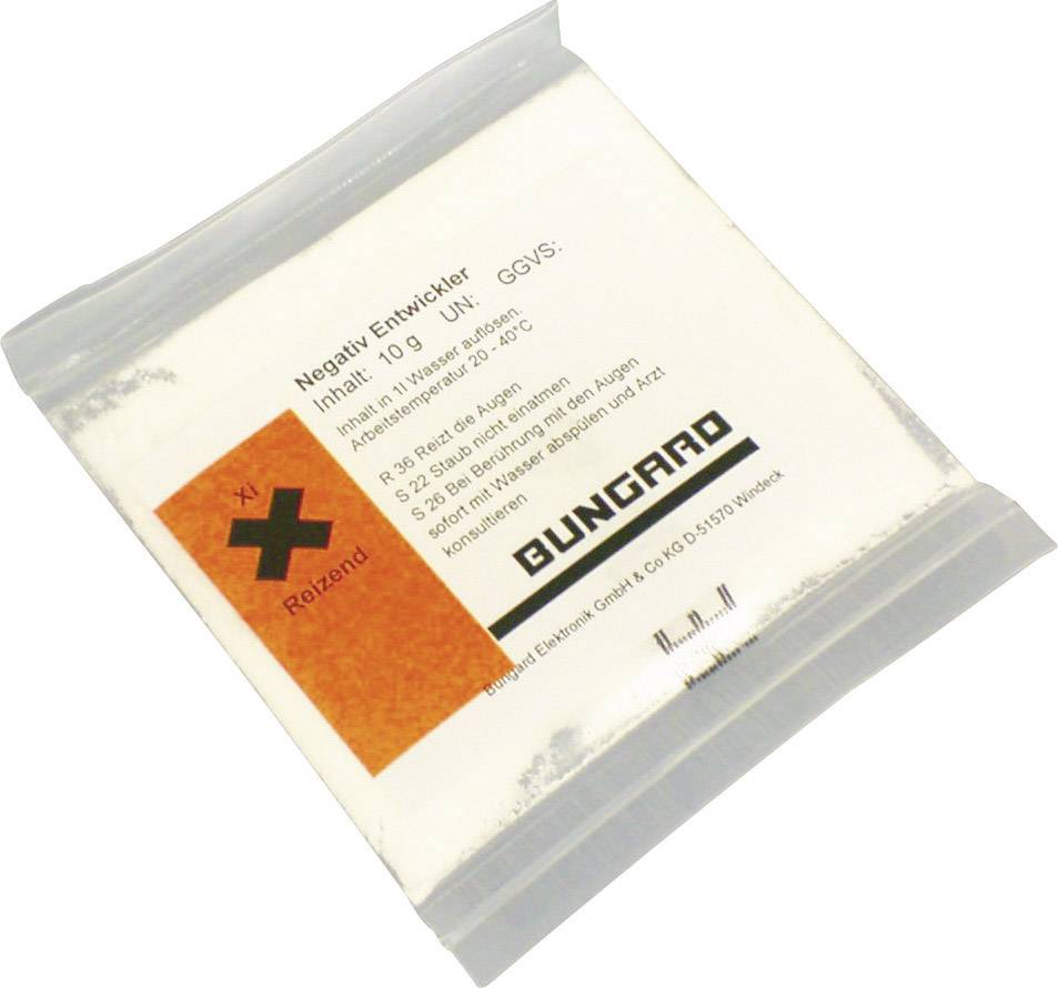 Emballage de 'Développeur négatif' avec instructions de sécurité et d'utilisation, avertissement de danger orange pour substances irritantes.