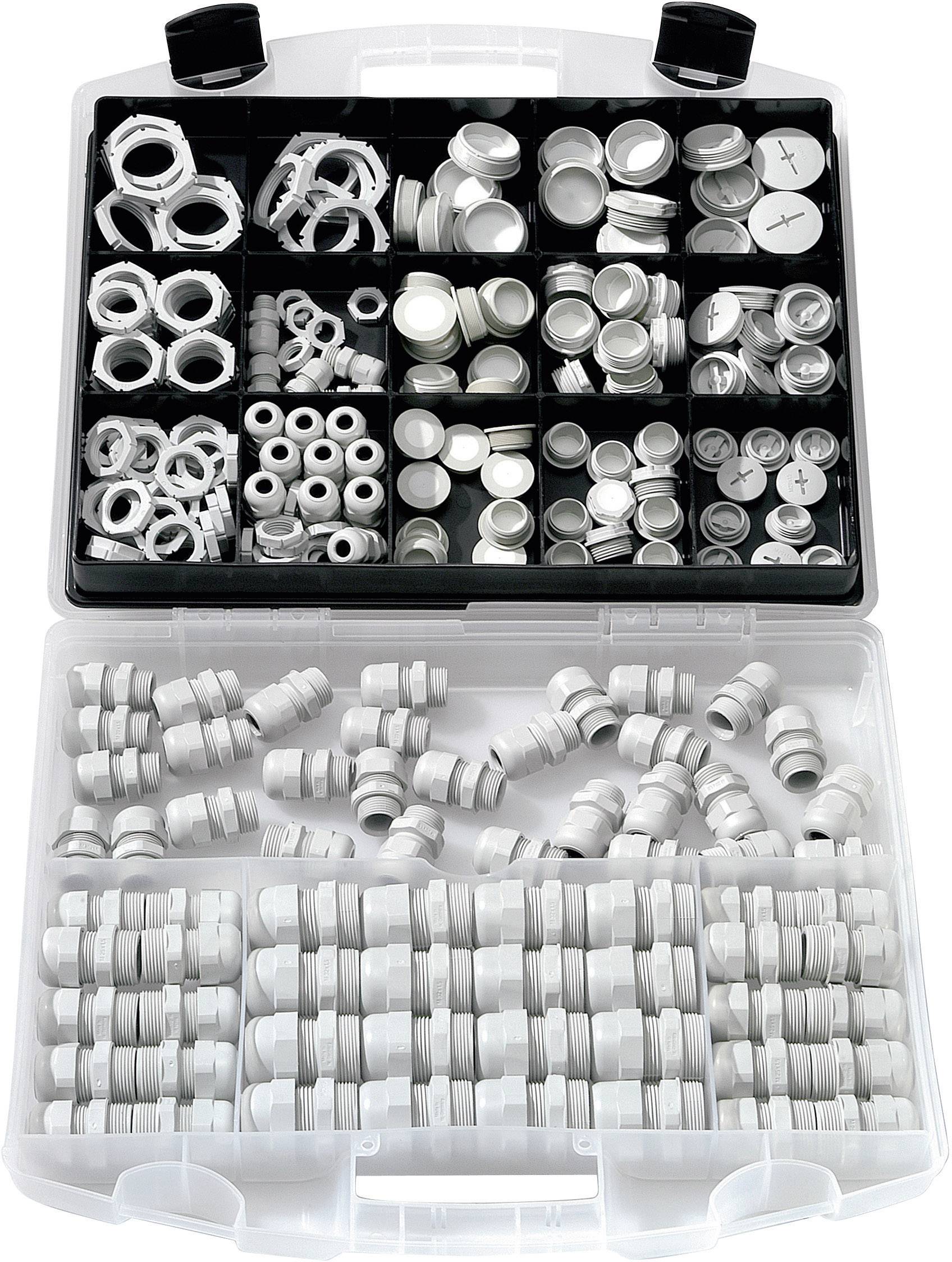 Une boîte triée contenant différentes pièces en plastique blanc, comprenant des écrous, des joints et des capuchons, organisés dans des compartiments.