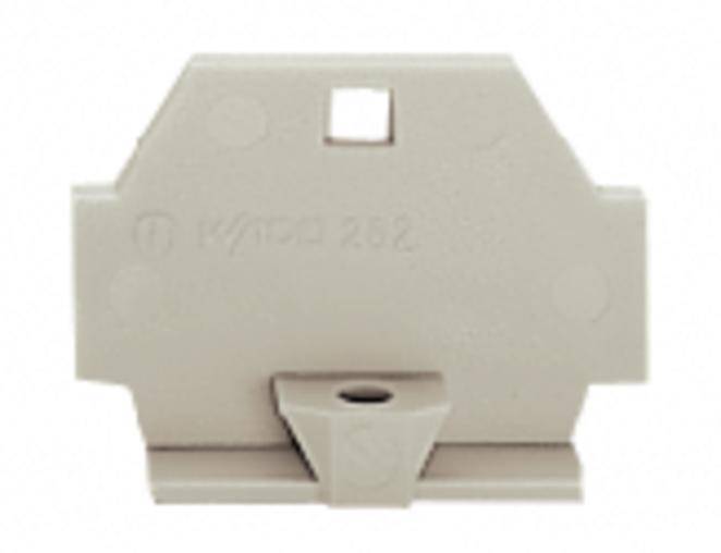 Pièce en plastique beige avec un design trapézoïdal arrondi et une ouverture centrale, probablement un composant d'équipement électrique.