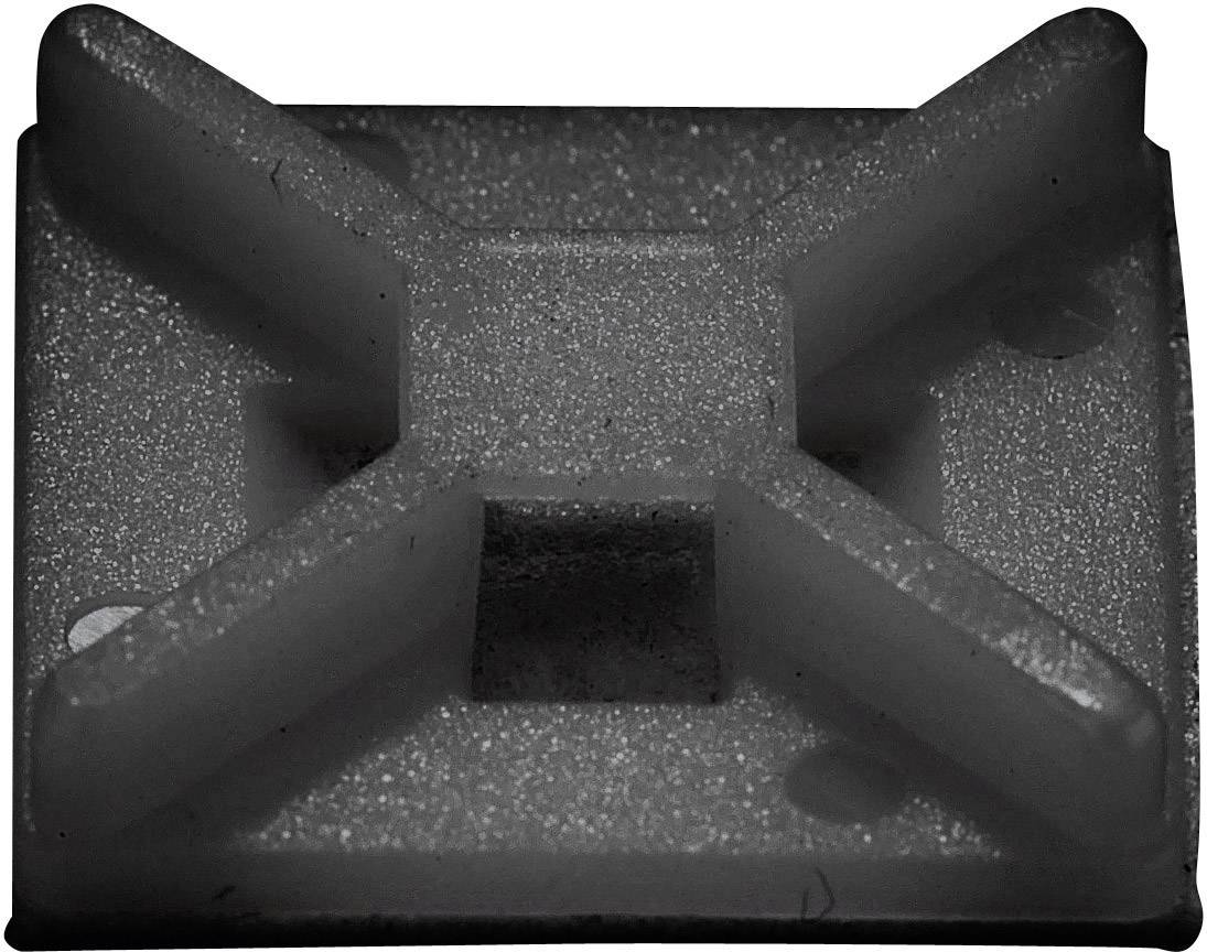 Une petite pièce carrée en plastique grise avec des nervures en X surélevées au centre, probablement un clip de fixation.