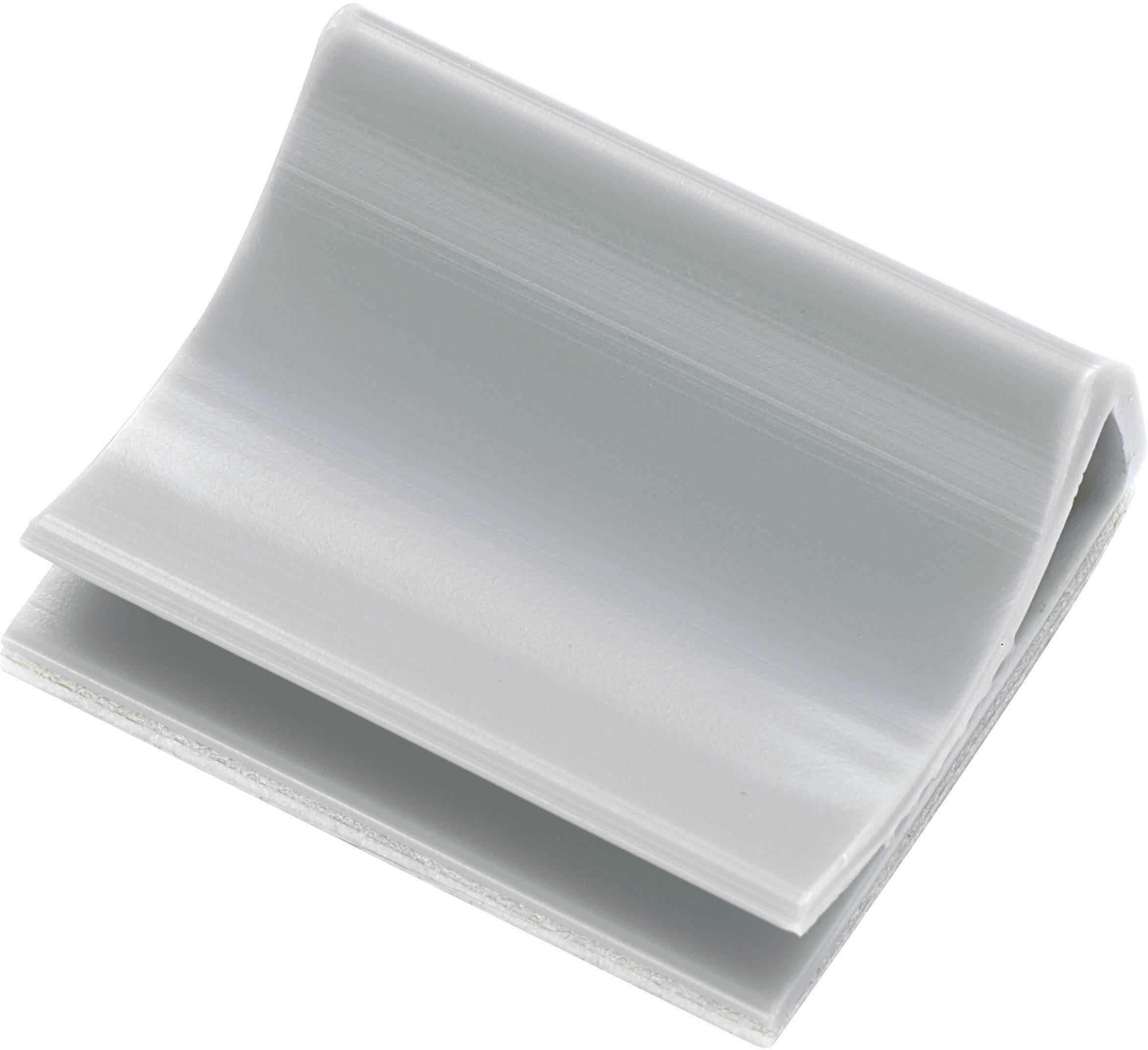 Un morceau de plastique gris plié, ressemblant à un rabat incliné, avec une surface lisse et des bords arrondis.