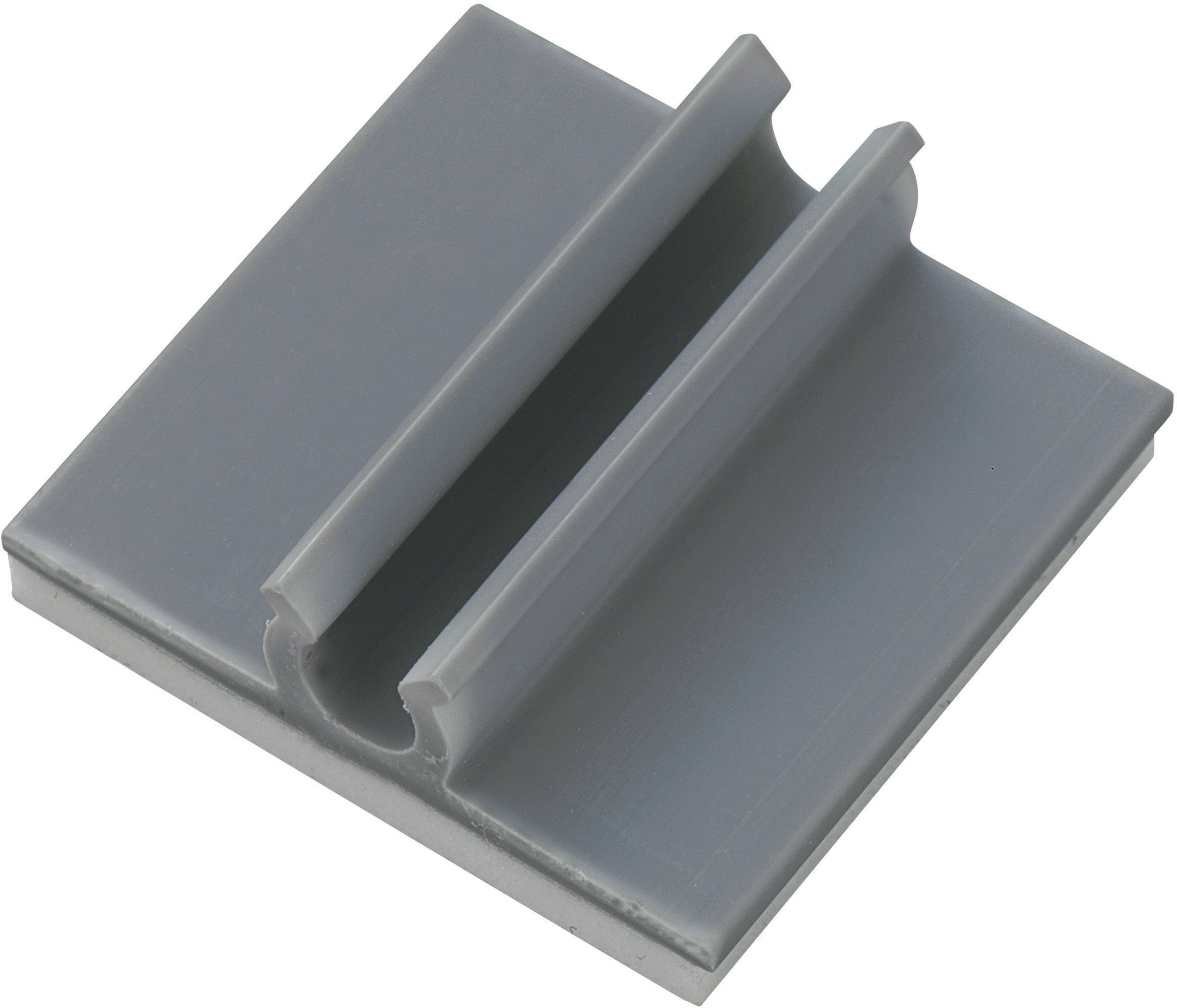 Un clip en plastique gris, rectangulaire, avec une rainure centrale. Le clip sert à fixer ou à guider des objets étroits.