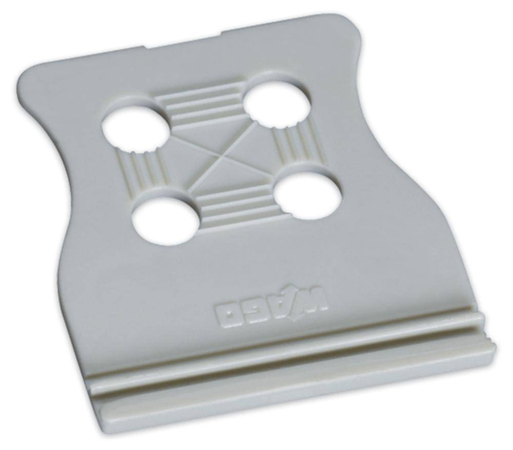 Un clip en plastique blanc avec quatre trous ronds et un motif structuré, souvent utilisé pour fermer les sacs de pain.