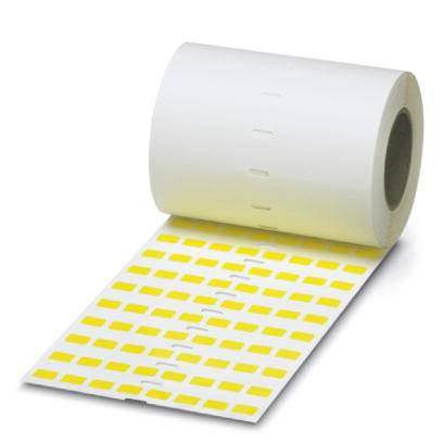 Un rouleau avec des étiquettes jaunes sur un fond blanc, partiellement déroulé, présente des étiquettes rectangulaires disposées en rangées ordonnées.