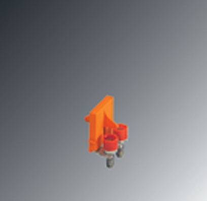 Un petit composant orange avec deux éléments de fixation cylindriques rouges et des pièces métalliques, sur un fond gris.
