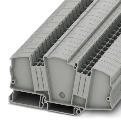 Composants en plastique gris, imbriqués les uns dans les autres, avec des rainures étroites et des cavités, probablement adaptés à des fins de construction.