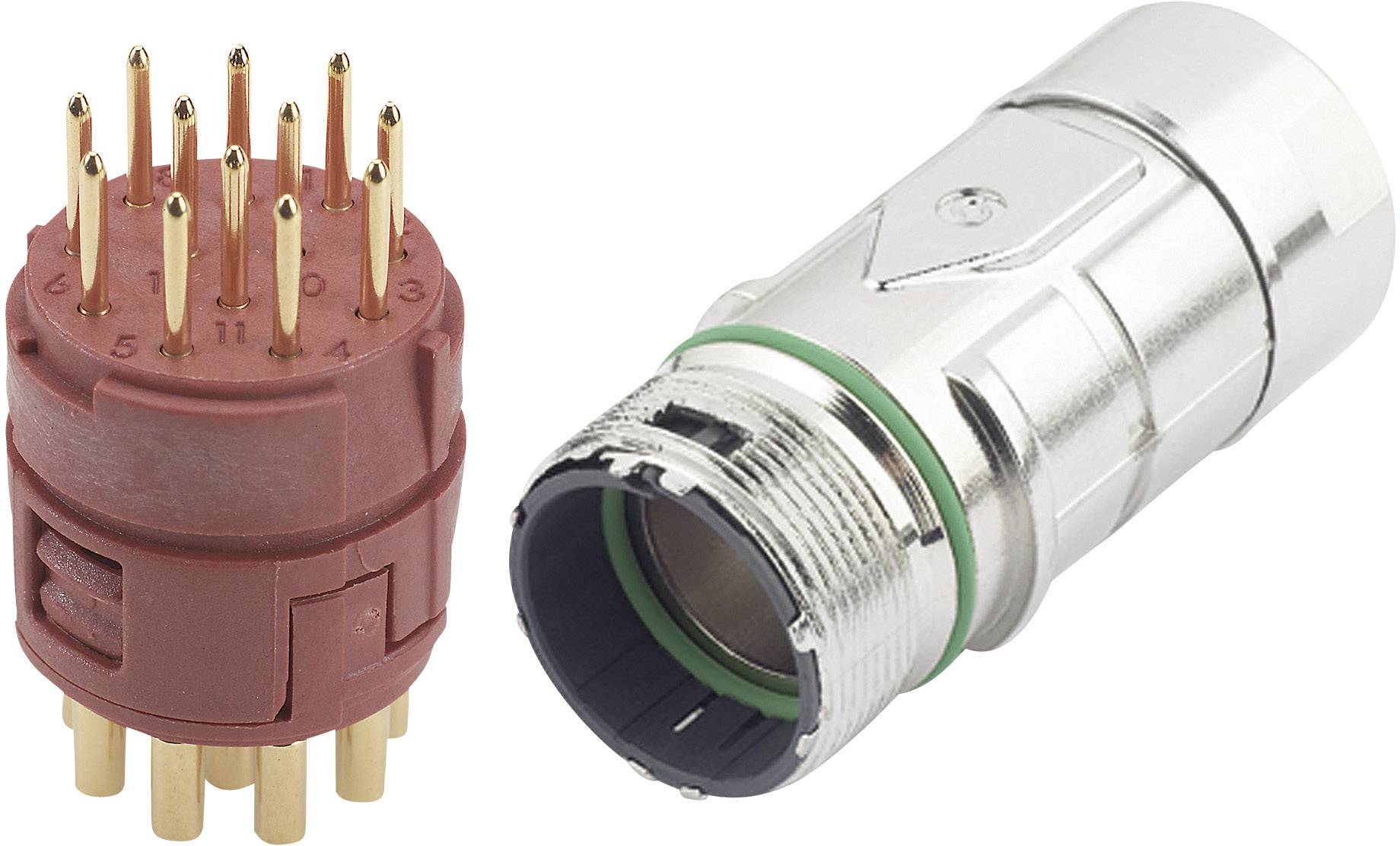 Un adaptateur de fiche multipolaire en rouge avec onze contacts, placé à côté d'une fiche ronde argentée, tous deux destinés à des connexions techniques.