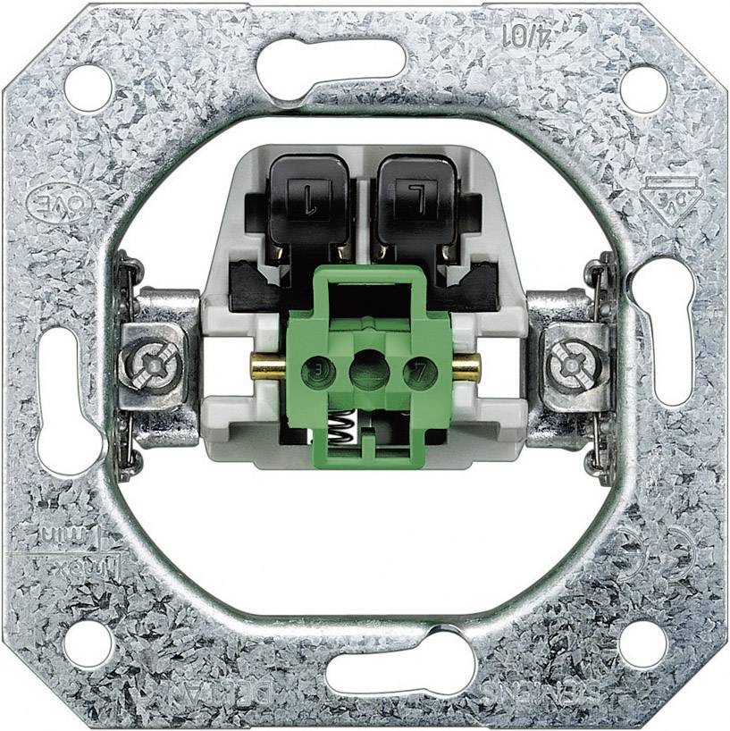 Un interrupteur électrique sans couvercle montre des composants verts et noirs dans un cadre métallique.