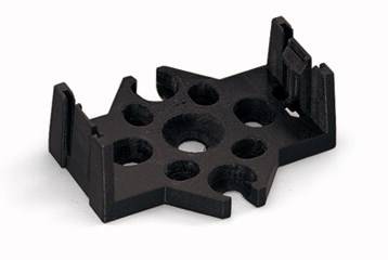 Une pièce en plastique noir en forme d'étoile avec cinq trous et des bords surélevés, probablement un composant de montage.