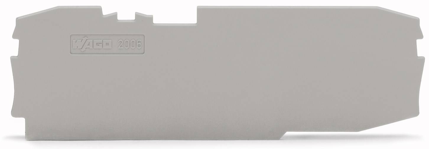 Pièce en plastique grise de forme rectangulaire aux bords découpés portant l'inscription 'Gag TM 2000'.