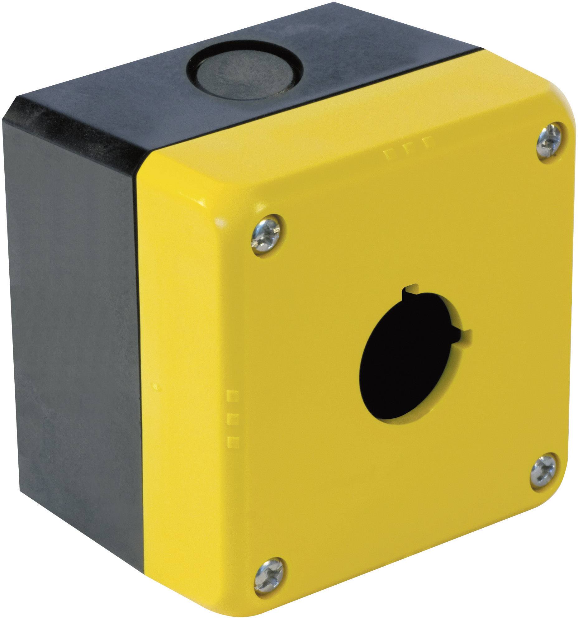 Boîtier jaune carré avec bordure noire, découpe circulaire centrale, quatre vis aux coins pour la fixation.