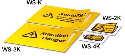 Panneaux d'avertissement jaunes avec les textes 'Attention !' et 'Danger', accompagnés de symboles d'avertissement pour tension électrique.