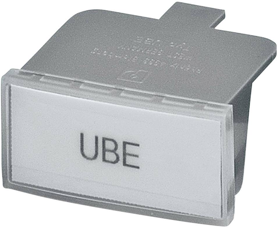 Une touche en plastique grise portant l'inscription 'UBE' sur un fond blanc.
