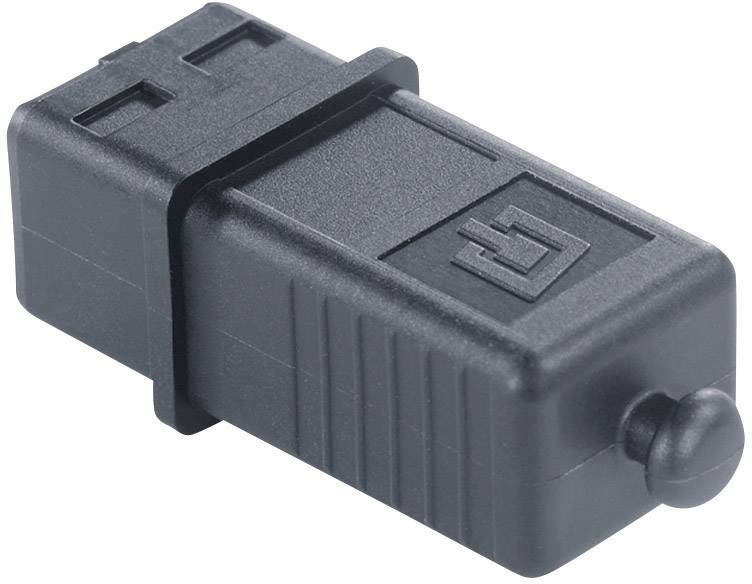 Un adaptateur en plastique noir de forme rectangulaire avec un raccordement rond à une extrémité. Des marquages sur la surface.