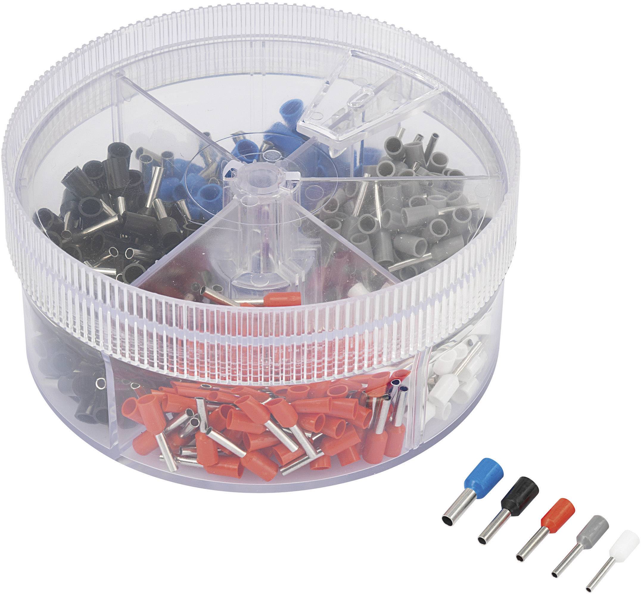 Une boîte ronde transparente avec plusieurs compartiments, remplie de embouts de câble de différentes couleurs : rouge, noir, bleu, blanc et gris.
