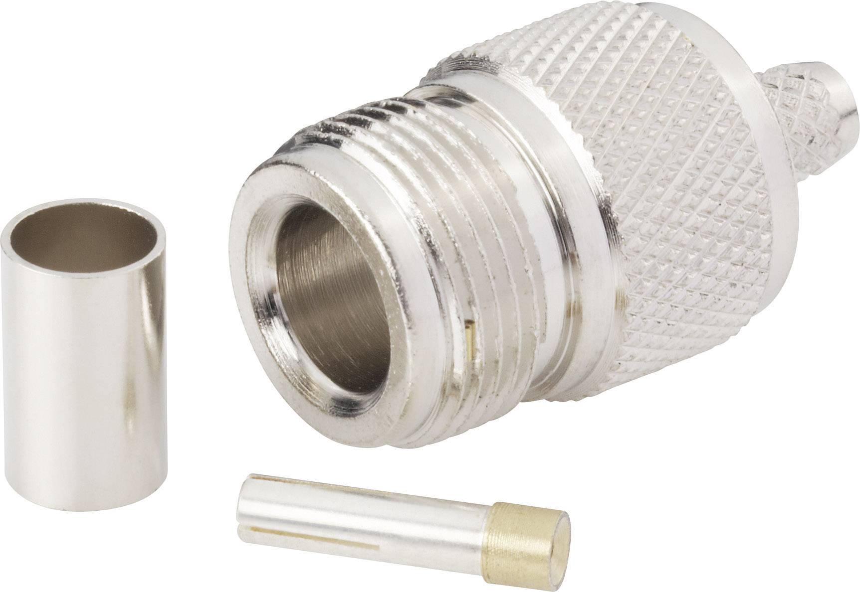 Une fiche argentée avec rainurage, une pièce accessoire cylindrique et une broche fine. Composants de connexion électronique.