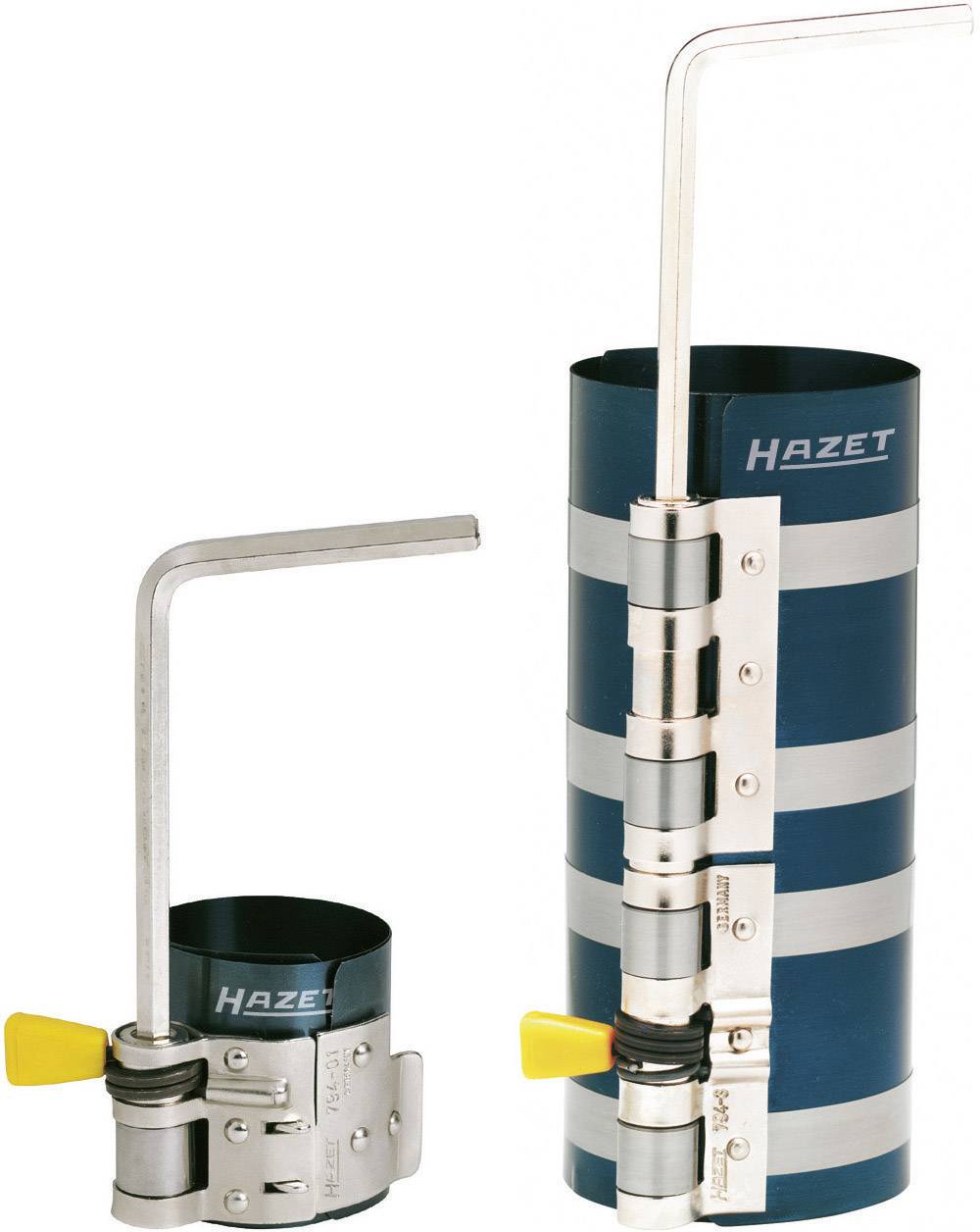 Deux compresseurs de segments de piston Hazet cylindriques en métal avec des poignées jaunes, utilisés pour la mise en place des segments de piston dans les moteurs.