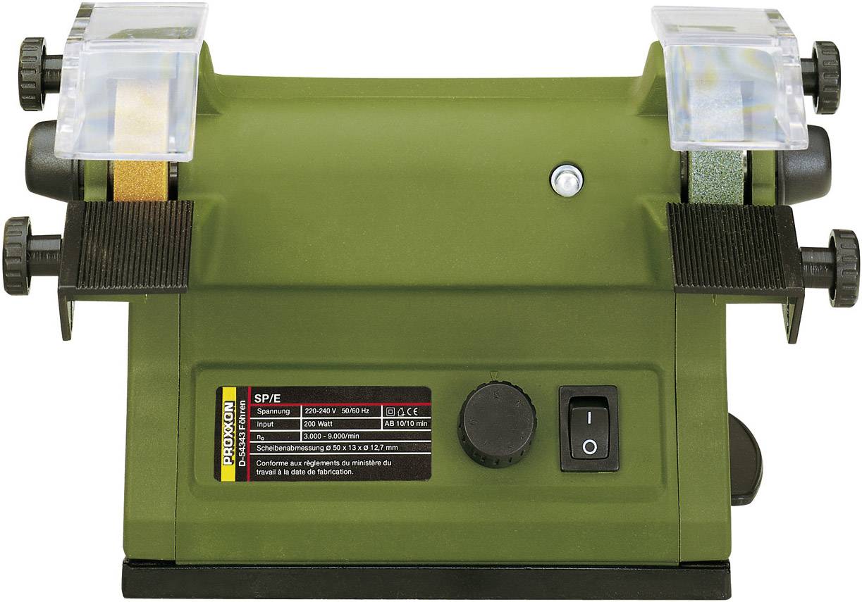 Un meuleuse double verte avec deux meules dans des protège-disques. Un interrupteur et une plaque signalétique sont situés sur la face avant.