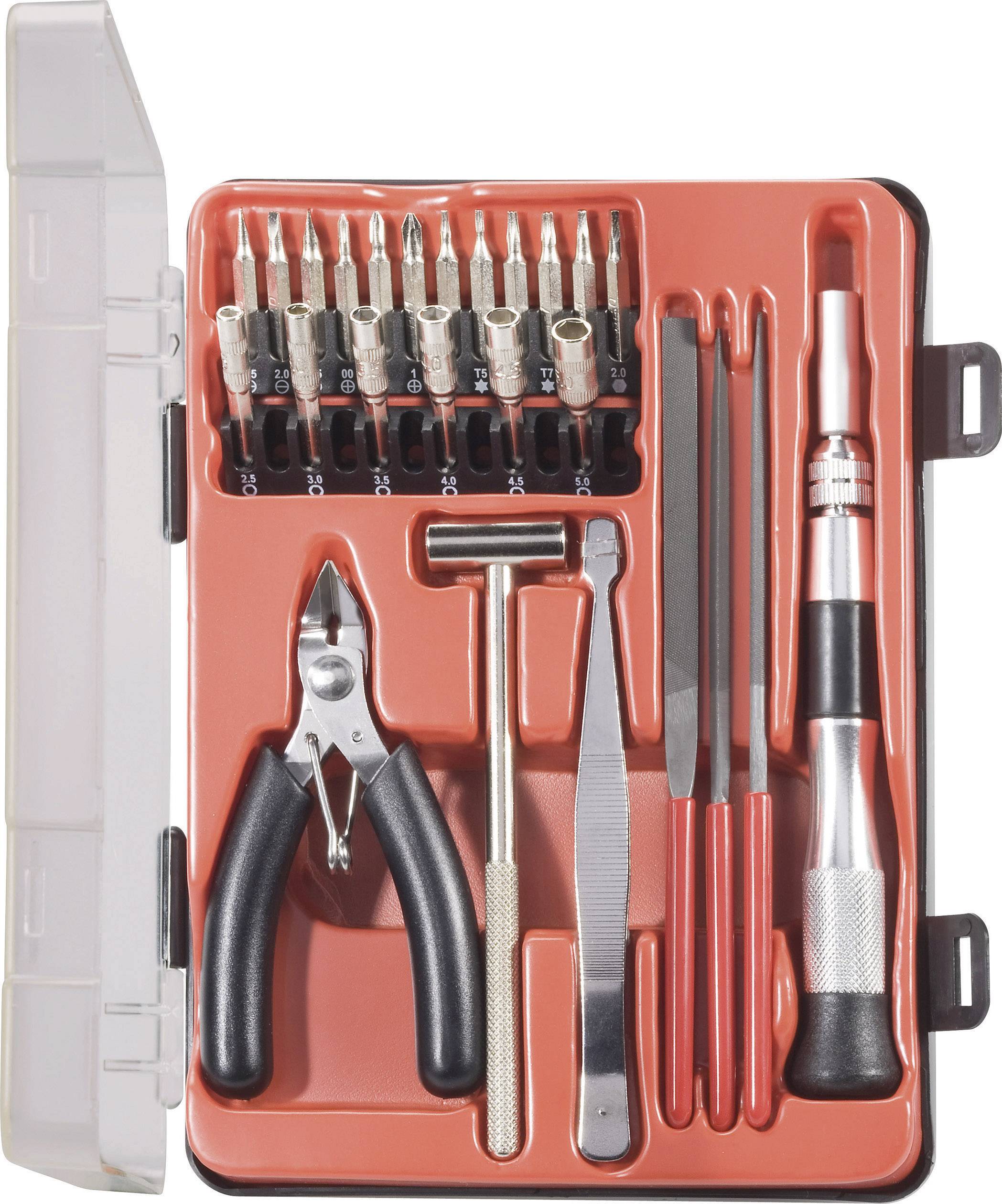 Ensemble d'outils dans un étui ouvert, comprenant des embouts de tournevis, des pinces, une pince, un marteau et des outils de mécanicien de précision.