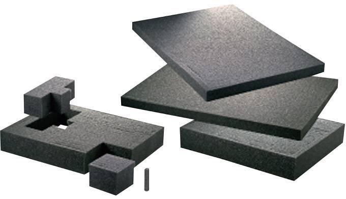 Plaques de mousse noire et blocs rectangulaires de différentes formes et tailles, empilés.