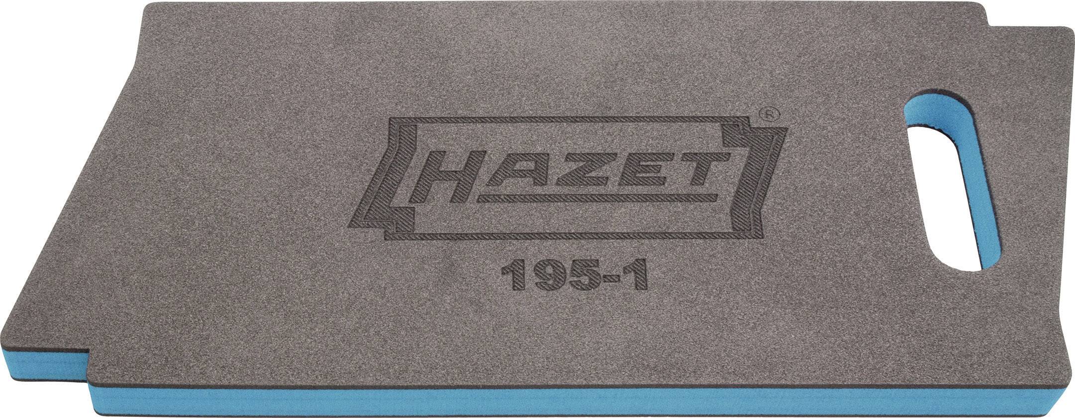 Tapis de protection pour les genoux gris avec l'inscription 'HAZET 195-1', face inférieure bleue. De forme rectangulaire avec un trou de préhension sur le côté.